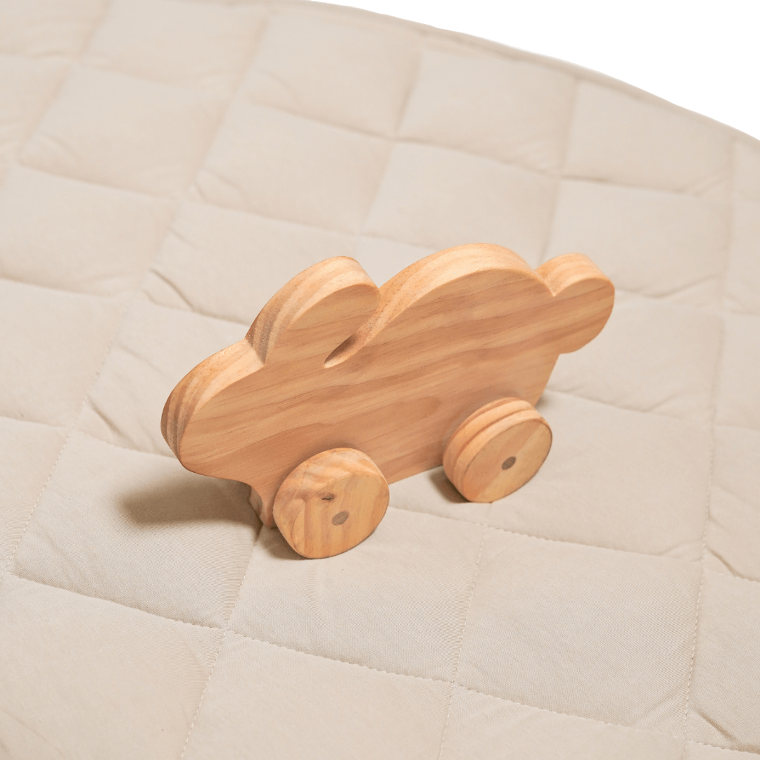 Wheat color jersey quilted play mat with waterproof backing and wooden toy car on top