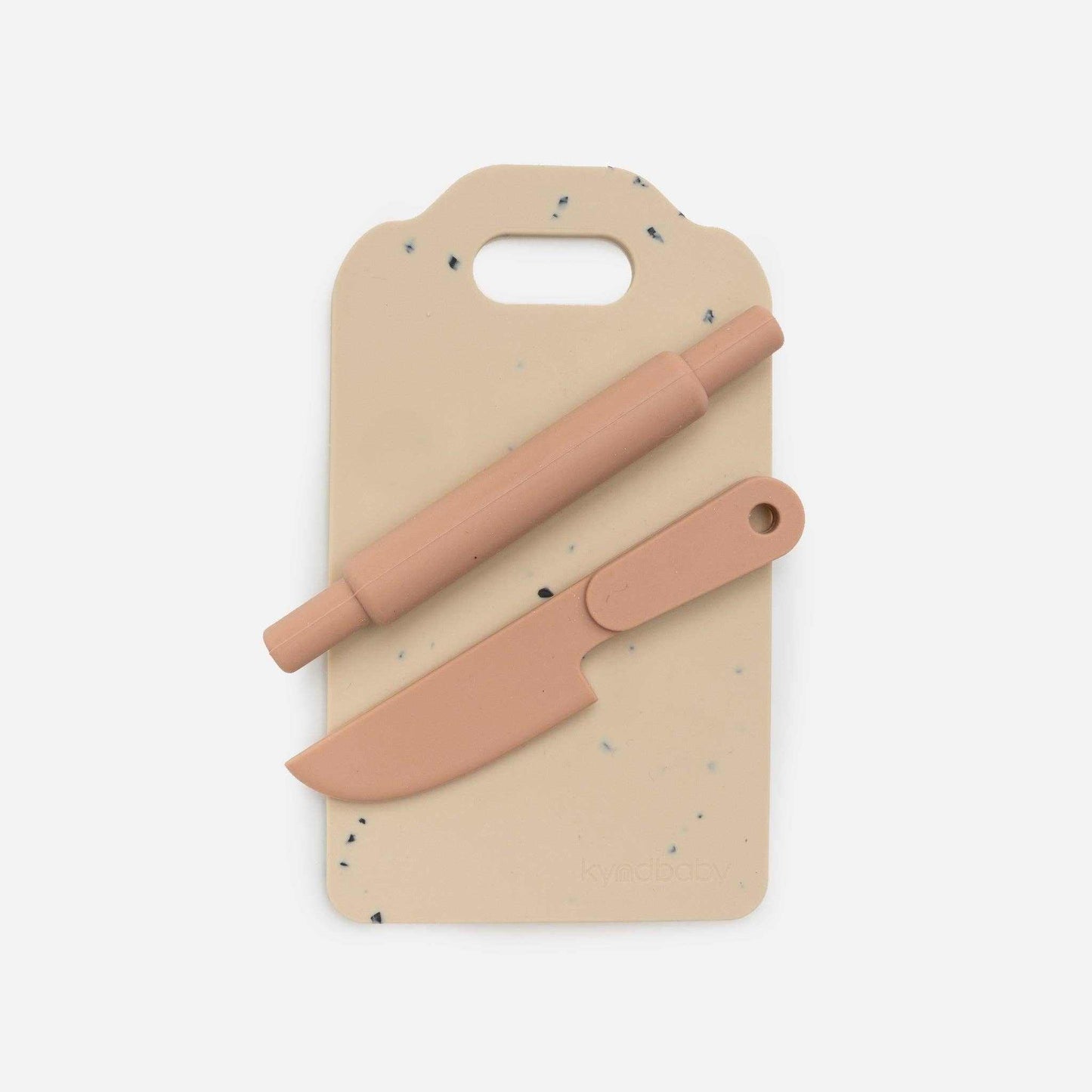 Kynd Silicone Kitchen Set with food-grade silicone rolling pin and knife on beige cutting board for kids' safe play