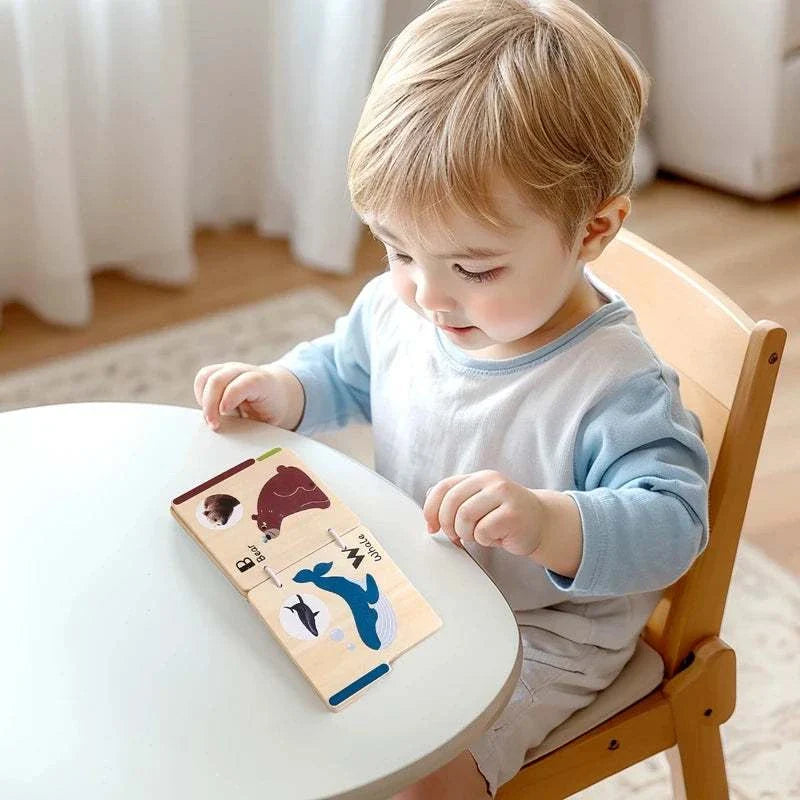 Toddler playing with wooden baby animal learning cards for early education and development