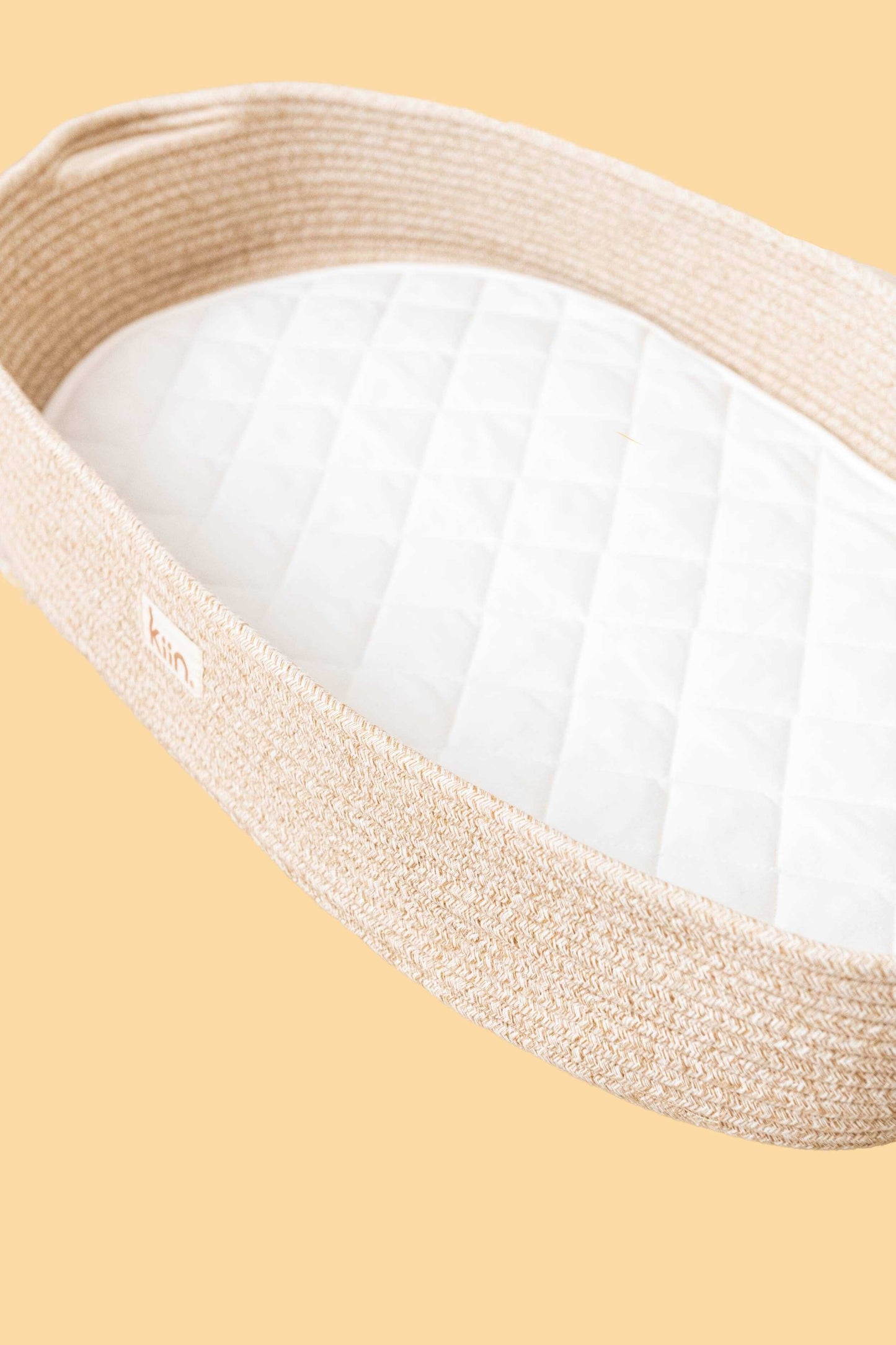 Kiin cotton rope change basket with white cotton liner on beige background for nursery decor and baby changing