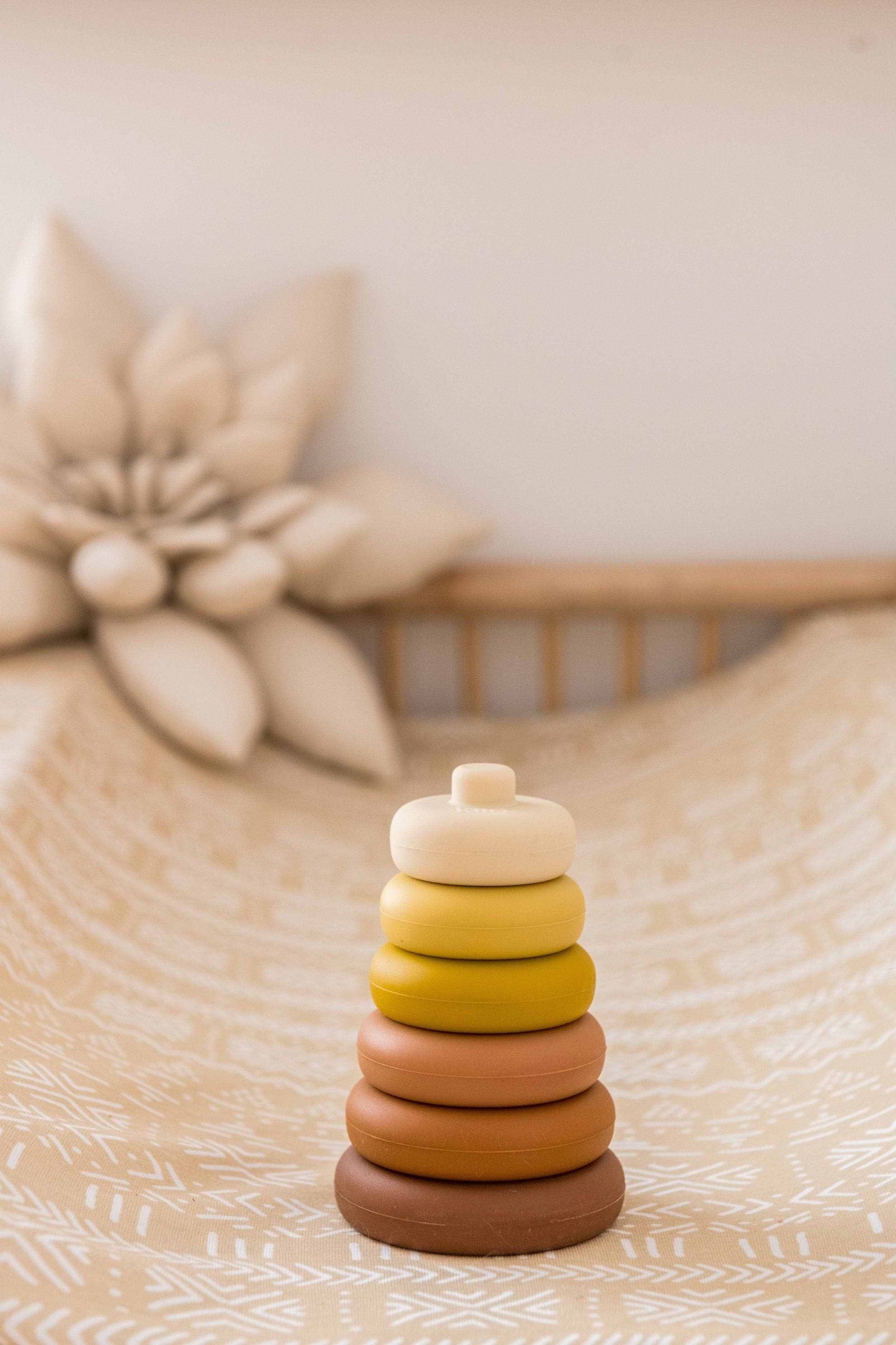 Kiin Round Stacking Tower toy made of soft, flexible, food-grade silicone in earthy colors for babies and toddlers