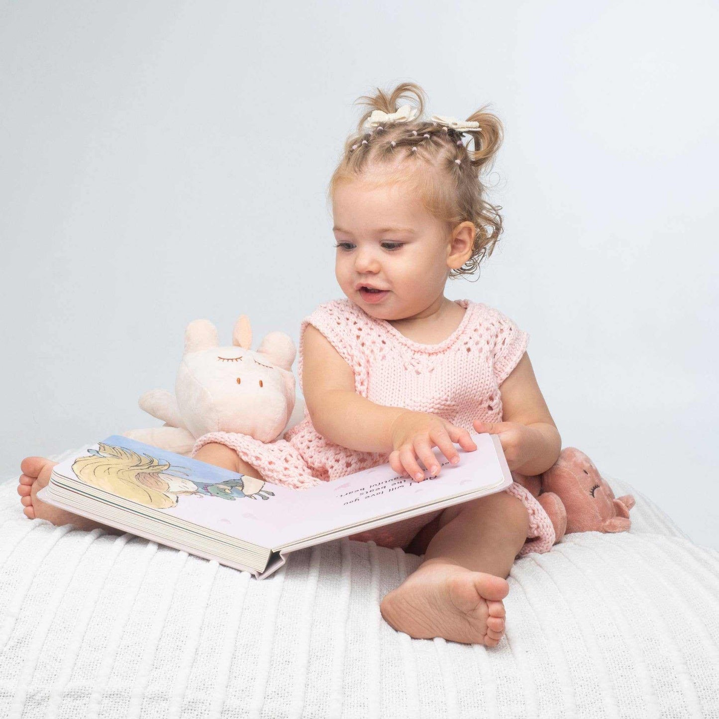Baby reading Love you all the Roars board book with Ezra Schnorglesaurus comforter set