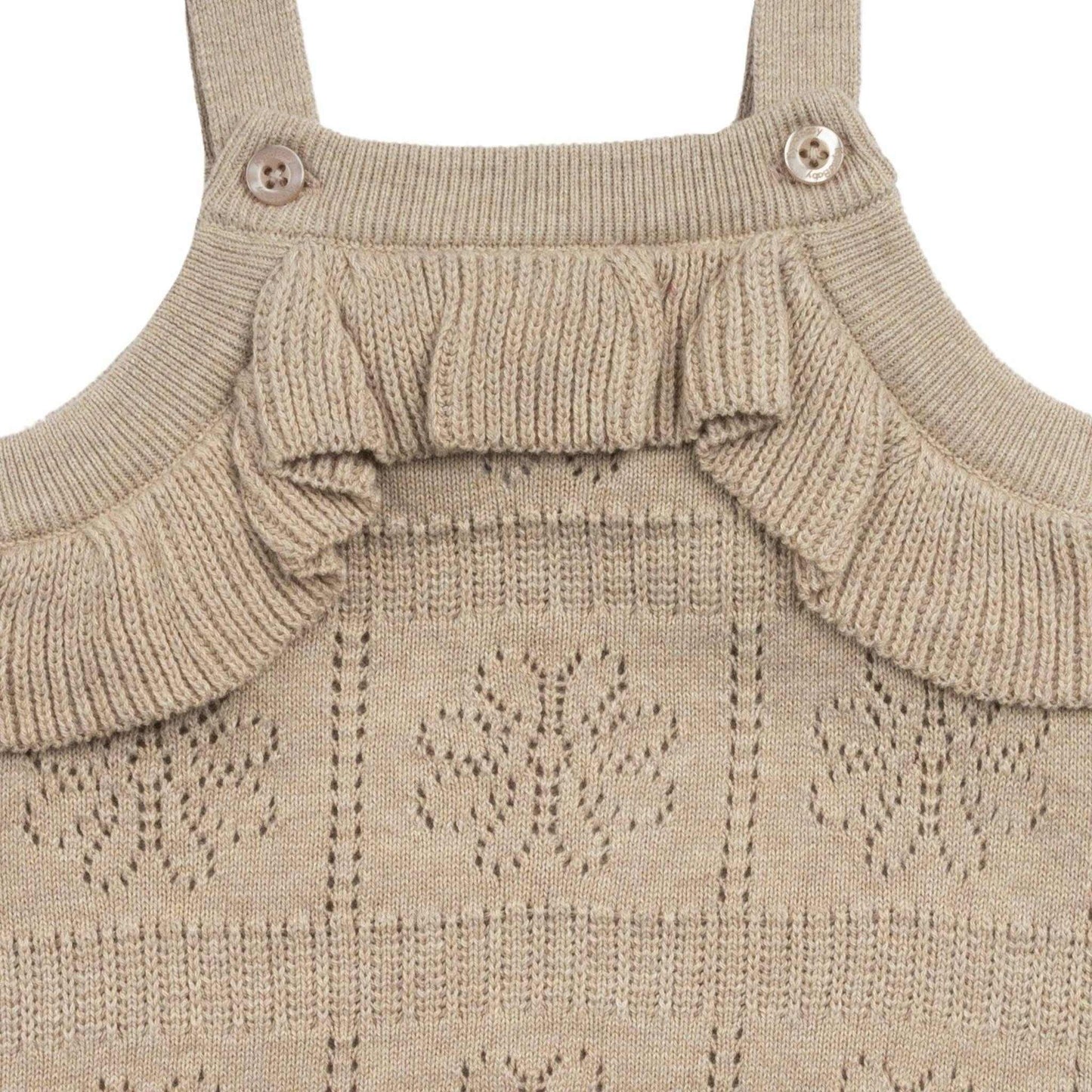 Kynd Pointelle Knit Frill Romper in neutral color with ruffled bodice and organic cotton knit pattern